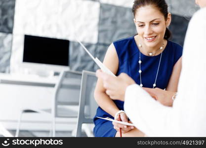 Two female colleagues in office. Two female colleagues working together in office