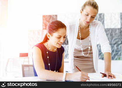 Two female colleagues in office. Two female colleagues working together in office