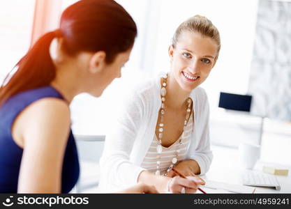 Two female colleagues in office. Two female colleagues working together in office