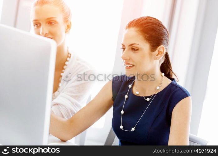 Two female colleagues in office. Two female colleagues working together in office