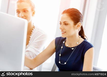 Two female colleagues in office. Two female colleagues working together in office