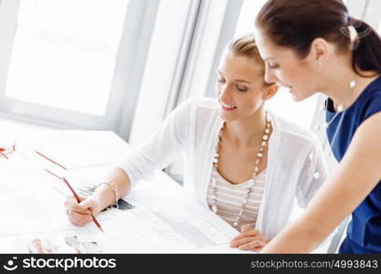 Two female colleagues in office. Two female colleagues working together in office