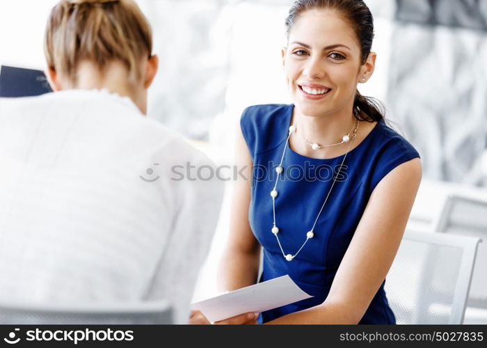 Two female colleagues in office. Two female colleagues working together in office