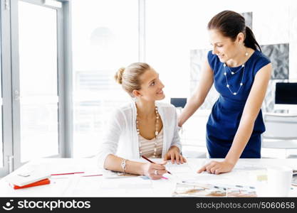 Two female colleagues in office. Two female colleagues working together in office