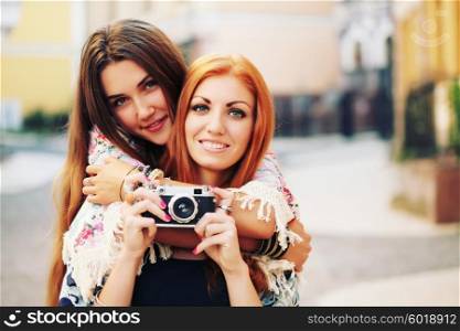 Two female friends hanging out with camera