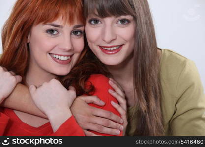 Two female friends hugging