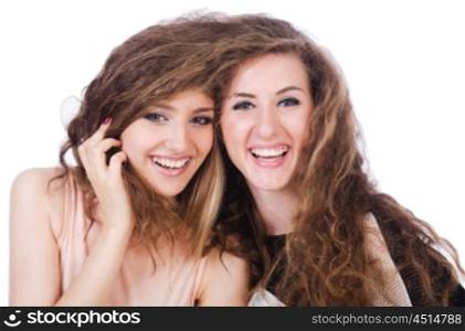 Two female friends isolated on the white