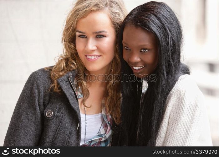 Two female friends looking at something interesting