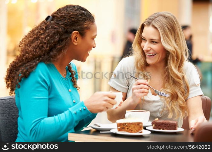 Two Female Friends Meeting In Cafe