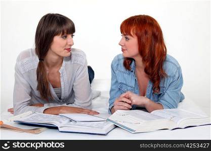 Two female friends studying.