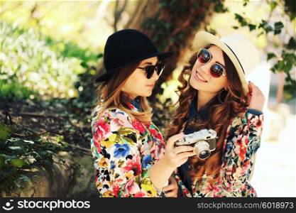 Two female friends taking pictures