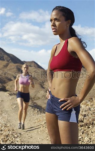 Two female joggers in mountains