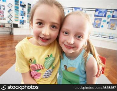 Two Female Primary Schoolchildren In Classroom