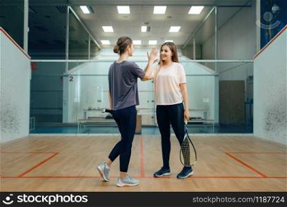 Two female squash players before competition. Girls on training, active sport hobby, fitness workout for healthy lifestyle. Two female squash players before competition