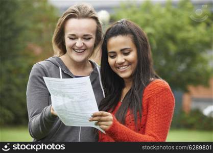 Two Female Students Celebrating Exam Results Together