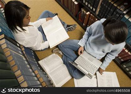 Two female students studying in the library