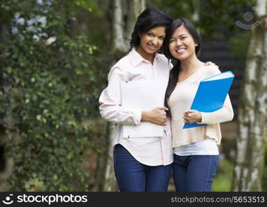 Two Female Teenage Students Outdoors