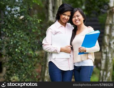 Two Female Teenage Students Outdoors