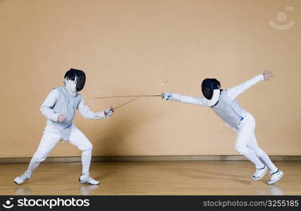 Two fencers fencing