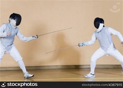 Two fencers fencing