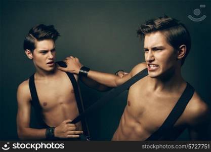 two fighting men in suspenders
