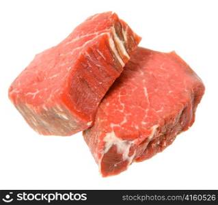 two filet mignon steaks, cut from beef tenderloin, isolated on a white background.