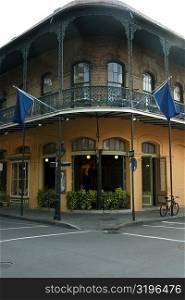 Two flags on the balcony of a building, French Quarter, New Orleans, Louisiana, USA