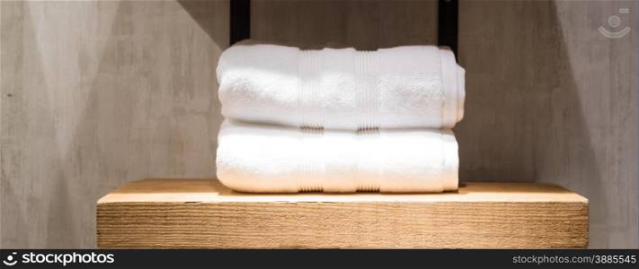 Two Fluffy White Towels on Bathroom Shelf