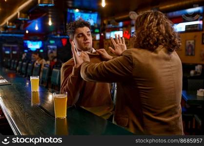 Two football fans fighting at sport bar counter. Angry man pulling other guy by sweater. Aggression, quarrel and conflict of drunk people. Two football fans fighting at sport bar counter