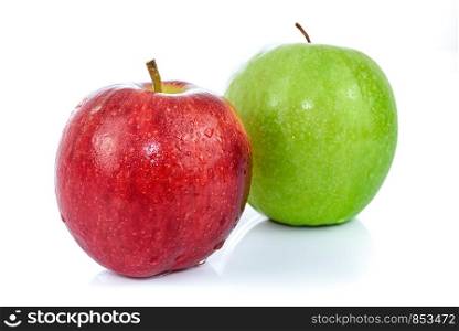 Two fresh apples in red and green color with drops of water and isolated on a white background.