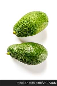 Two fresh avocados isolated on a white background. Two avocados isolated on a white background