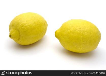 Two Fresh lemons closeup on white background