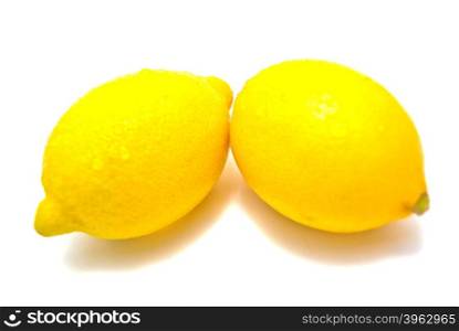 Two fresh lemons on white