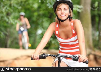 Two friend cycling in the countryside