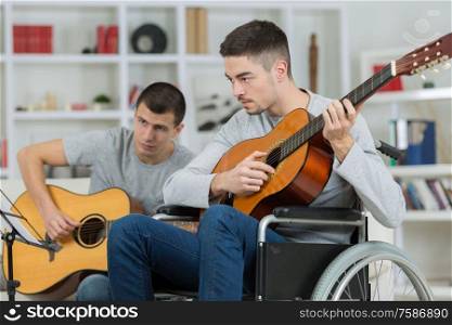 two friends are playing guitar
