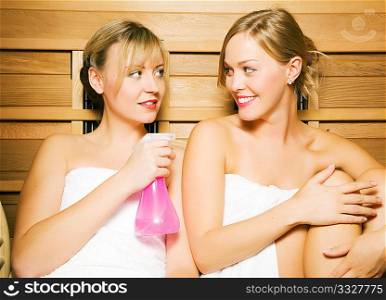 Two friends (female) enjoying a sauna