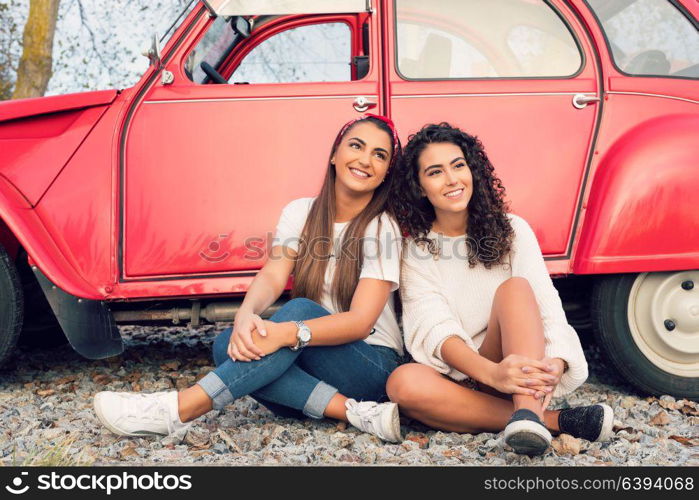 Two friends going on a roadtrip through countryside