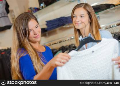 Two friends looking at a jumper