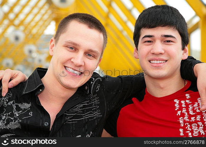 two friends on footbridge