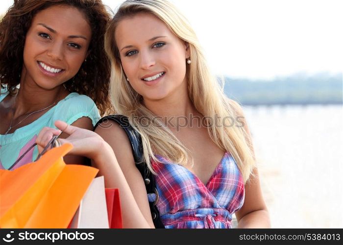 Two friends with shopping bags