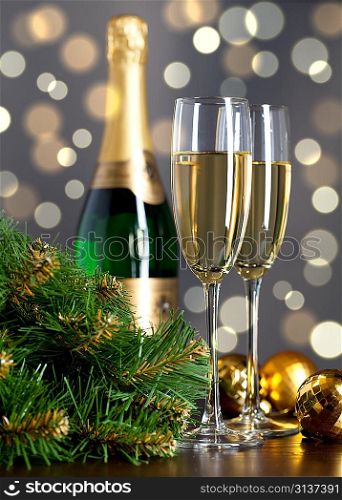 Two full glasses of champagne over color background