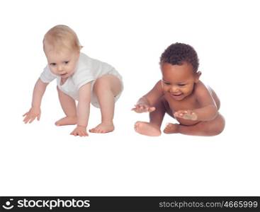 Two funny babies learning to walk isolated on a white background