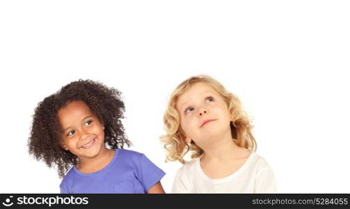 Two funny children looking up isolated on a white backround