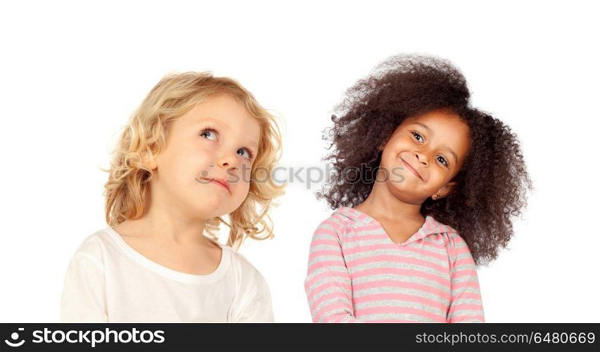 Two funny children looking up isolated on a white backround. Two funny children looking up