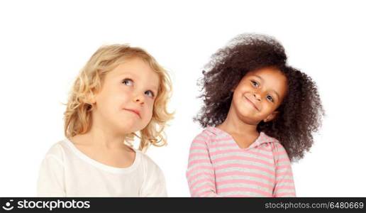 Two funny children looking up isolated on a white backround. Two funny children looking up