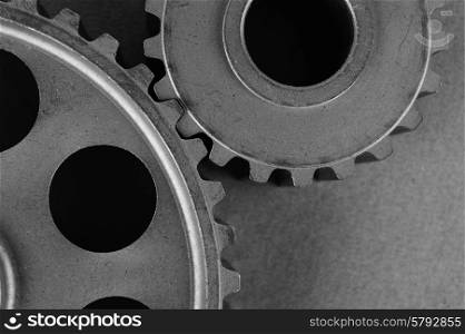 Two gears on a gray background