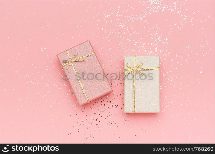 Two gift boxes of pastel colors on pink background, Top view.. Two gift boxes of pastel colors on pink background, Top view
