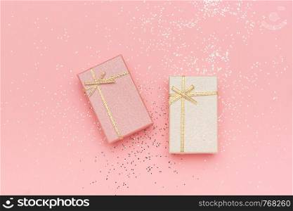 Two gift boxes of pastel colors on pink background, Top view.. Two gift boxes of pastel colors on pink background, Top view
