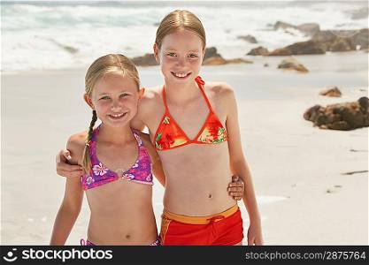 Two girls (7-9 10-12) posing on beach portrait