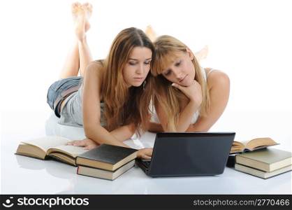 Two girls are preparing for the exam. Isolated on white background
